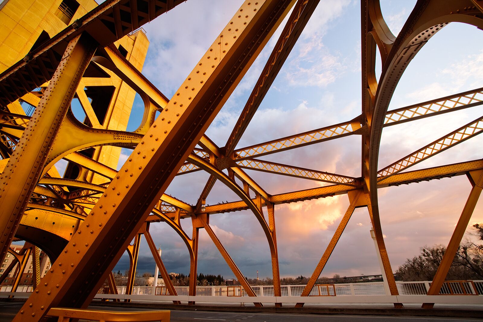 This bridge connects west Sacramento to Sacramento.  It leads directly to state capitol of California.  This district is home to old wild west attractions where you can ride an old west train and Steamboats.  There's also the railroad museum nearby.