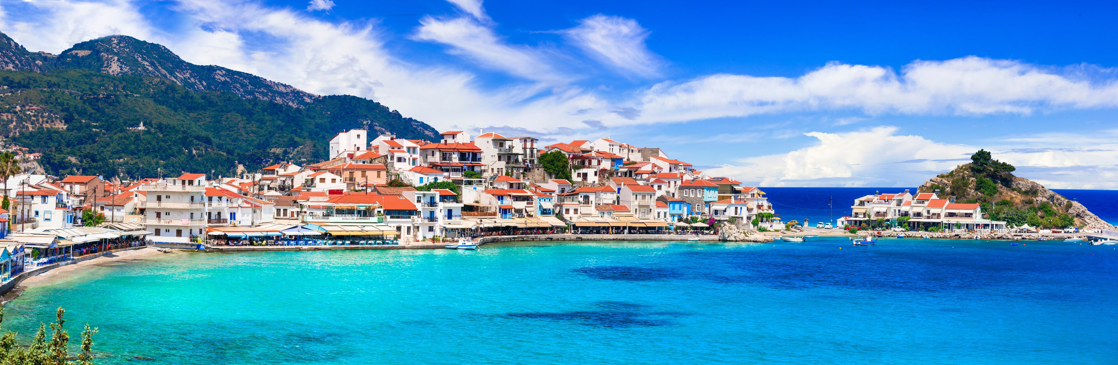 Most beautiful traditional villages of Greece - Kokkari in Samos island. crystal sea and taverns