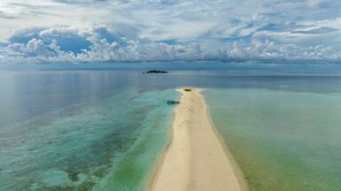 Tropical landscape with a beautiful beach. Timba Timba islet. Tun Sakaran Marine Park. Borneo, Sabah, Malaysia.