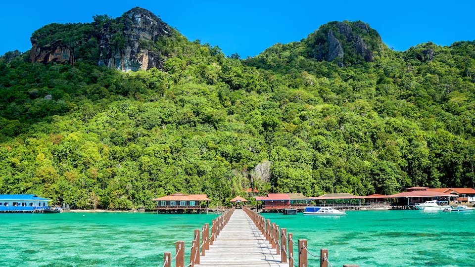 Jetty to Bohey Dulang Island in Sabah, Malaysia, one of a few islands in Sabah made of volcanic rock. The island is famous for its clear crystal water, beautiful corals and scenic mountainous view, Sh