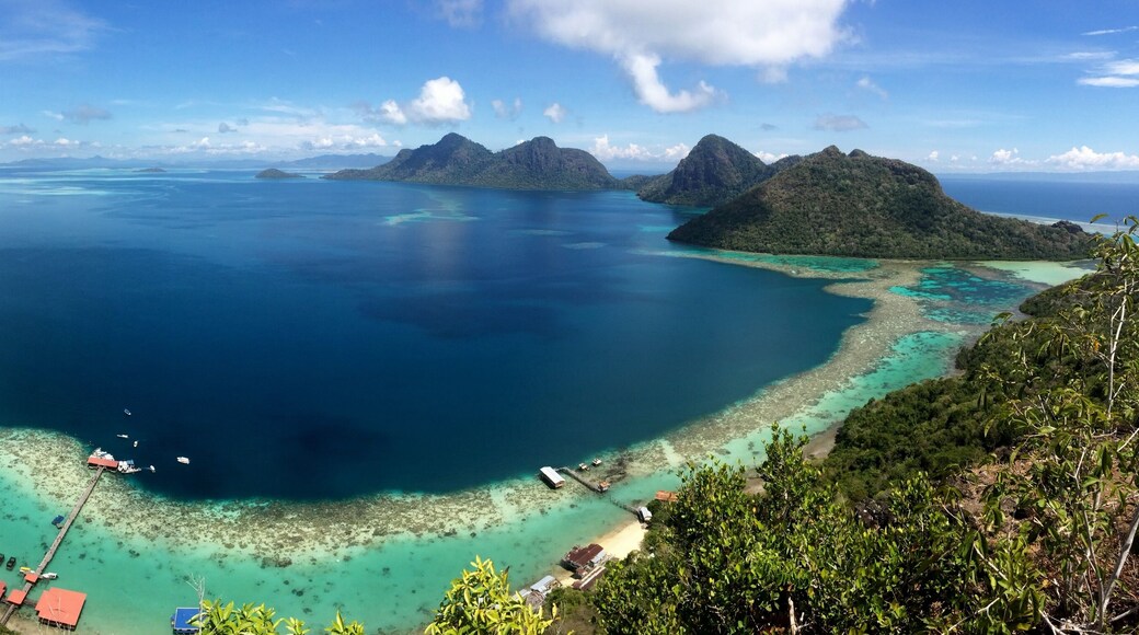 Ask a boatman at the Semporna dock to bring you to Bohey Dulang. From the jetty it is a short but sweaty hike to this viewpoint. The waters down here in the Tun Sakaran marine park are excellent for snorkling and cooling down after your hike :-)
