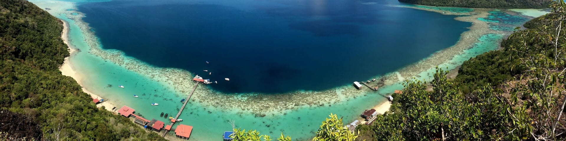 Ask a boatman at the Semporna dock to bring you to Bohey Dulang. From the jetty it is a short but sweaty hike to this viewpoint. The waters down here in the Tun Sakaran marine park are excellent for snorkling and cooling down after your hike :-)