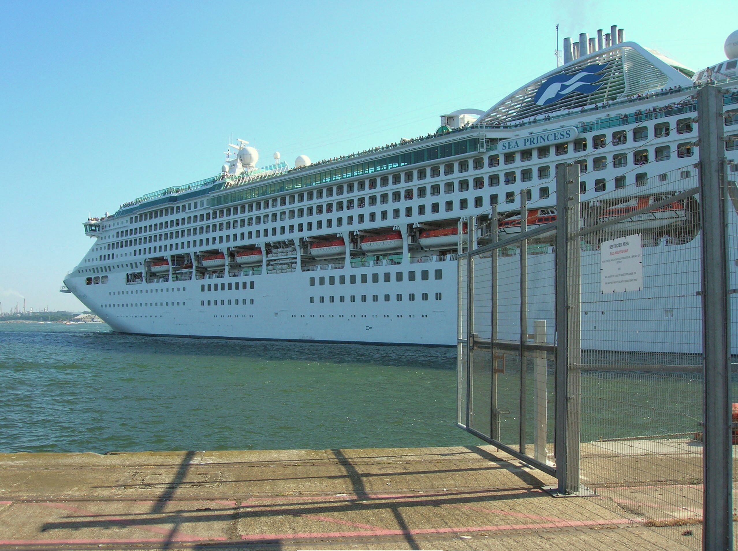 The cruise ship Sea Princess leaving Southampton harbour ; fences are visible on the right, which have prevented access to the ship under the ISPS code.