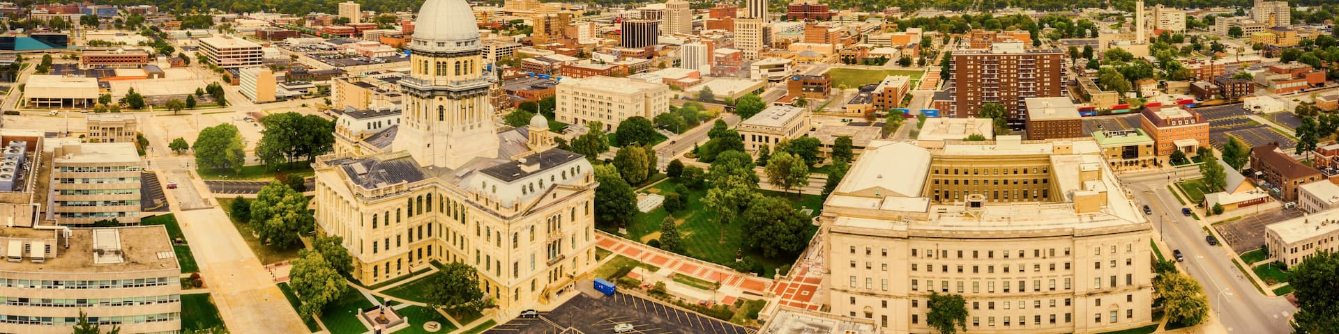 Aerial panorama of the Illinois State Capitol dome and Springfield skyline under a dramatic sunset. Springfield is the capital of the U.S. state of Illinois and the county seat of Sangamon County