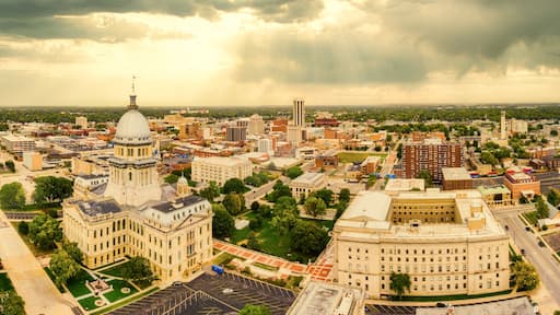 Aerial panorama of the Illinois State Capitol dome and Springfield skyline under a dramatic sunset. Springfield is the capital of the U.S. state of Illinois and the county seat of Sangamon County