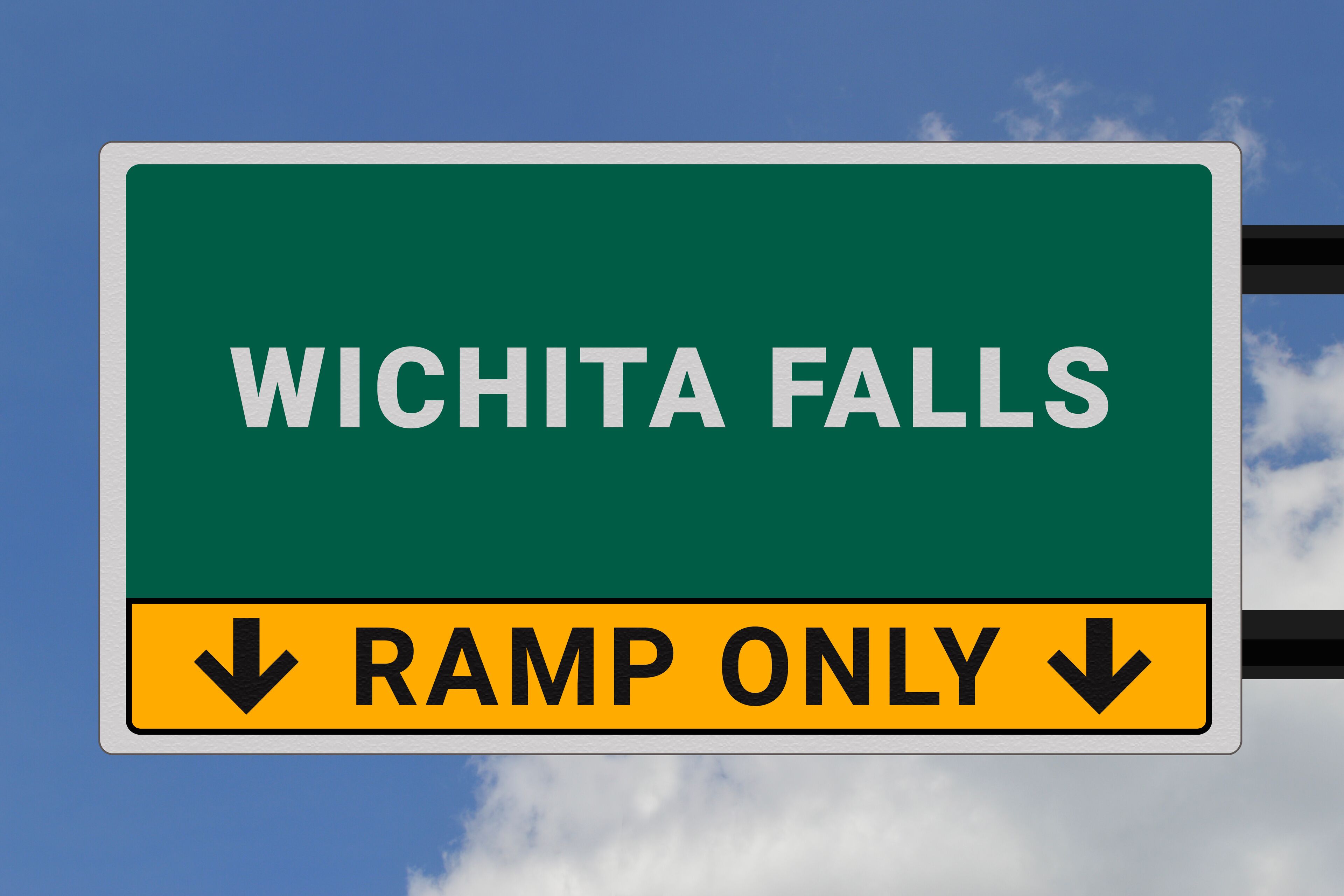 Wichita Falls logo. Wichita Falls lettering on a road sign. Signpost at entrance to Wichita Falls, USA. Green pointer in American style. Road sign in the United States of America. Sky in background