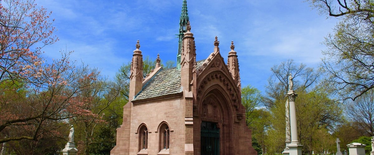 Bellefontaine Cemetery is a nonprofit, non-denominational cemetery and arboretum located in St. Louis, Missouri. Founded in 1849 as a rural cemetery, Bellefontaine is home to a number of architecturally significant monuments and mausoleums such as the Louis Sullivan-designed Wainwright Tomb, which is listed on the National Register of Historic Places. The cemetery contains 314 acres of land and over 87,000 graves, including those of William Clark, Adolphus Busch, Thomas Hart Benton, and William S. Burroughs. Many Union and Confederate soldiers from the American Civil War are buried at Bellefontaine, as well as numerous local and state politicians.
As of 2012 over 87,000 people have been buried at Bellefontaine Cemetery, and approximately 100 new burials take place each year. Bellefontaine remains a non-profit, non-denominational cemetery, and still holds over 100 acres of open, unused land. Some of this extra land has recently been converted into prairie and woodland. Bellefontaine contains over 14 miles of paved roads and, as an accredited arboretum, is home to over 180 species of trees and shrubs. A new lakeside garden and columbarium were completed in 2010, and other major landscaping projects are planned or in progress.
The cemetery contains the graves of many prominent pioneers to the West, as well as businessmen, politicians, and generals who remain significant figures in the history of St. Louis and the United States. The oldest graves in the cemetery are located on pioneer Edward Hempstead’s family lot and date as far back as 1816. Many of the wealthiest families at Bellefontaine are interred in ornate mausoleums which overlook the Mississippi River and draw from Classical, Romanesque, Gothic, and Egyptian architectural styles. Among the most notable mausoleums in the cemetery are: the Wainwright Tomb, designed for Charlotte Dickson Wainwright by the famed Chicago school architect Louis Sullivan in 1892; the Busch Mausoleum, designed for Adolphus Busch and Lilly Anheuser by Barnett, Haynes & Barnett in 1915; and the Brown Brothers Mausoleums, designed in 1910 by Isaac Taylor and in 1928 by Mauran, Russell and Crowell. There are also a number of large family plots in the cemetery, many of which are marked by tall obelisk monuments with elaborate bases. Guided tours of the cemetery’s main historical and architectural highlights are available and are open to the public. Alternatively, visitors can obtain self-guided tour brochures at the cemetery office.
The cemetery was listed on the National Register of Historic Places in 2014.
#LIFEATEXPEDIA