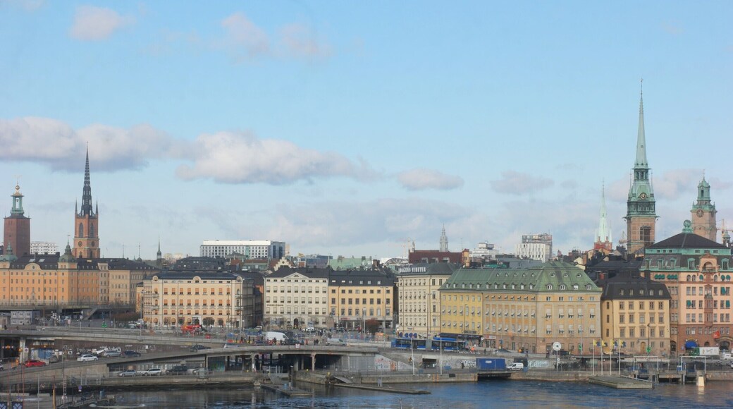 Slussenområdet (the Sluice area) is an area of central Stockholm, on the Söderström river connecting Södermalm and Gamla stan. The area is named after the locks between Lake Mälaren and the Baltic Sea. Called Karl Johanslussen, the locks themselves allow passage between these two bodies of water (of different levels). Slussen also refers to the cloverleaf interchange and associated pedestrian passages and walkways created in 1935.
The Slussen metro station is a hub of public transport in Stockholm, serving the red and green lines of the Stockholm Metro, with an adjoining bus terminal and Saltsjöbanan commuter rail station serving the eastern parts of Stockholm and its surroundings. Djurgårdsfärjan departs adjacently.
It is unclear exactly when the channel at Slussen was created, but in the centuries up to the 17th century the differences in level between the Lake Mälaren with the Baltic Sea made it increasingly difficult to pass through the Söderström channel. The first lock was built here in 1642, Queen Christina's Lock. By the early 1700s the lock proved too small and in 1751 the Christopher Polhem Lock was completed. In 1850 an even larger lock was completed, the Nils Ericson lock.
- Wikipedia