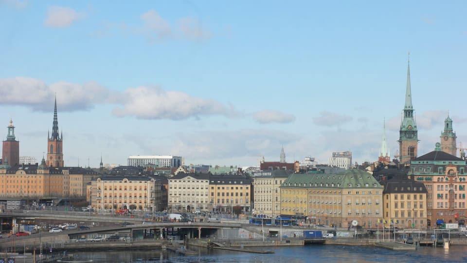 Slussenområdet (the Sluice area) is an area of central Stockholm, on the Söderström river connecting Södermalm and Gamla stan. The area is named after the locks between Lake Mälaren and the Baltic Sea. Called Karl Johanslussen, the locks themselves allow passage between these two bodies of water (of different levels). Slussen also refers to the cloverleaf interchange and associated pedestrian passages and walkways created in 1935.
The Slussen metro station is a hub of public transport in Stockholm, serving the red and green lines of the Stockholm Metro, with an adjoining bus terminal and Saltsjöbanan commuter rail station serving the eastern parts of Stockholm and its surroundings. Djurgårdsfärjan departs adjacently.
It is unclear exactly when the channel at Slussen was created, but in the centuries up to the 17th century the differences in level between the Lake Mälaren with the Baltic Sea made it increasingly difficult to pass through the Söderström channel. The first lock was built here in 1642, Queen Christina's Lock. By the early 1700s the lock proved too small and in 1751 the Christopher Polhem Lock was completed. In 1850 an even larger lock was completed, the Nils Ericson lock.
- Wikipedia
