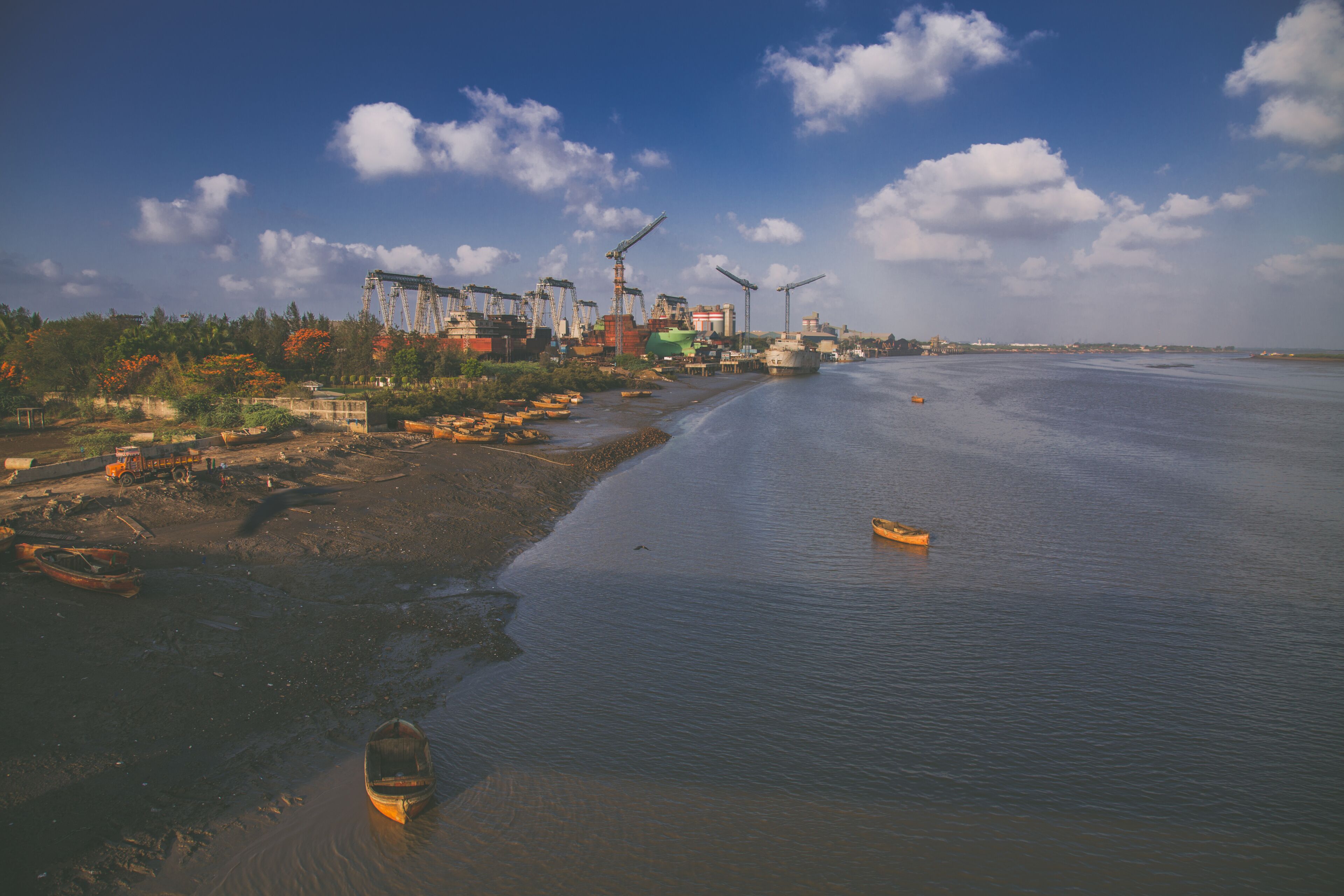 view of the river industrial boats landscape wallpaper india surat gujarat clouds sky blue morning sunlight natural photography background