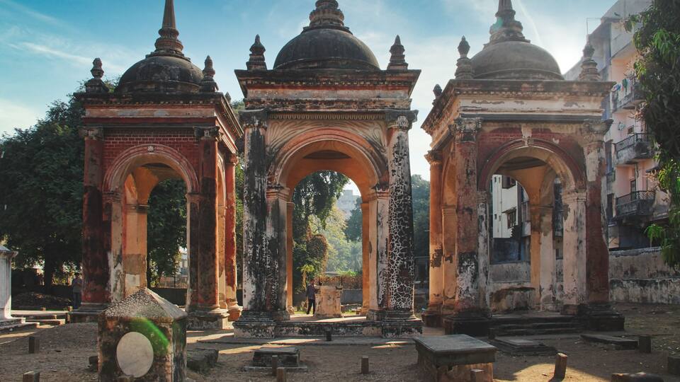 An ancient temple with domed structures and arches.