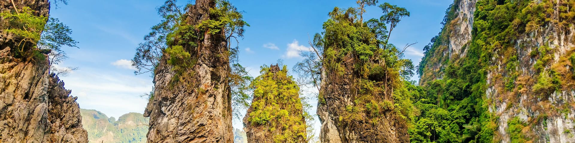 Beautiful mountains lake river sky and natural attractions in Ratchaprapha Dam at Khao Sok National Park, Surat Thani Province, Thailand.; Shutterstock ID 244029868