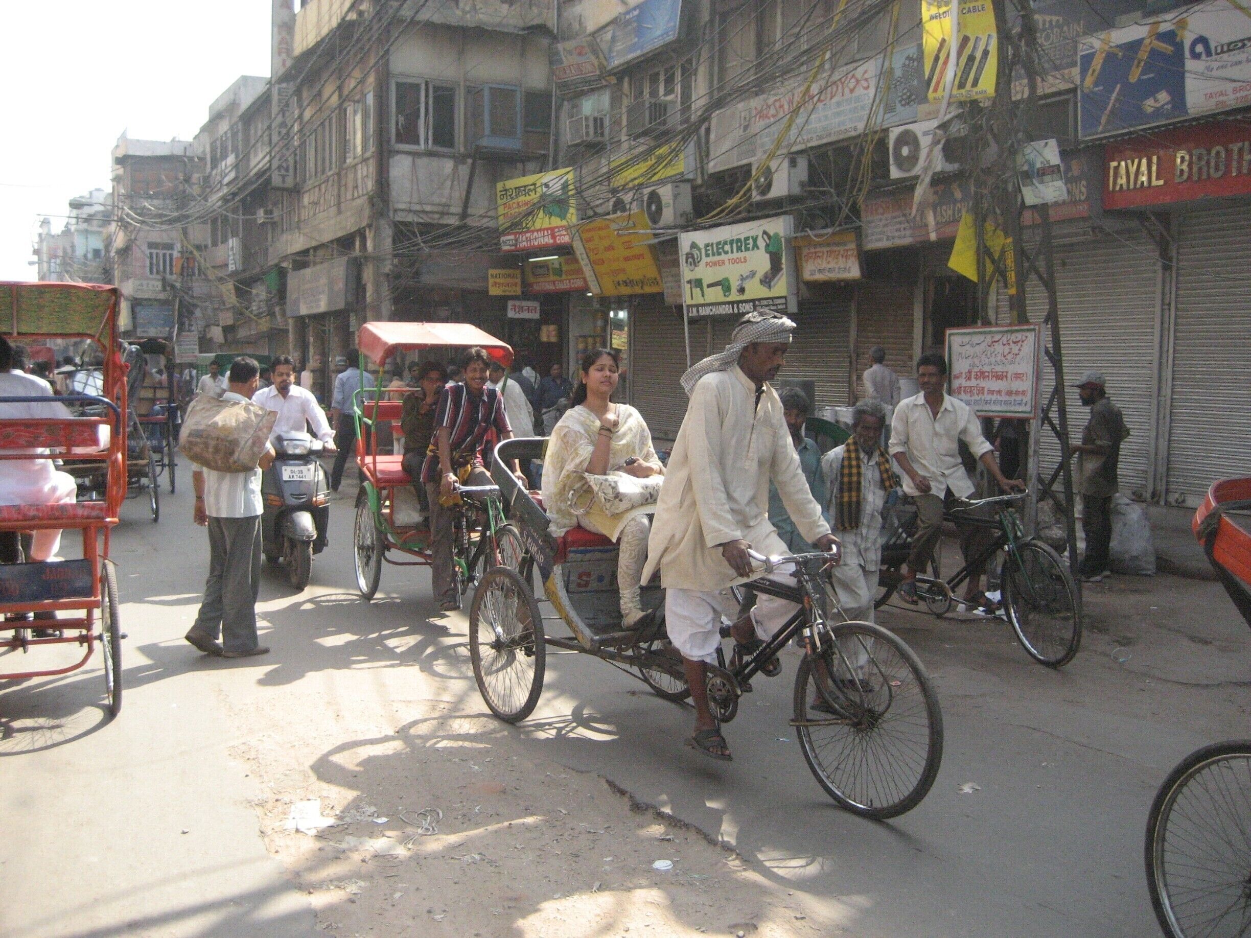 The bustling streets of the old market of New Delhi are a heady mixture of noise and smells. There are a lot of tourists in the rickshaws and yet it retains its authenticity as a market area. #markets