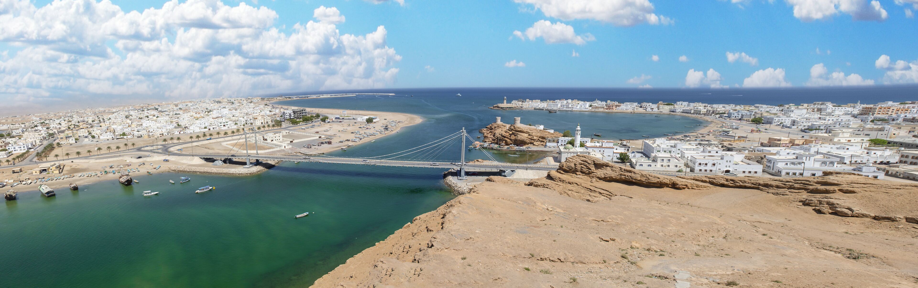 Sur, Oman - an important point for sailors and famous also for its building wooden ships, Sur is a pearl of Oman, with its fusion of green waters, white buildings and red rocks