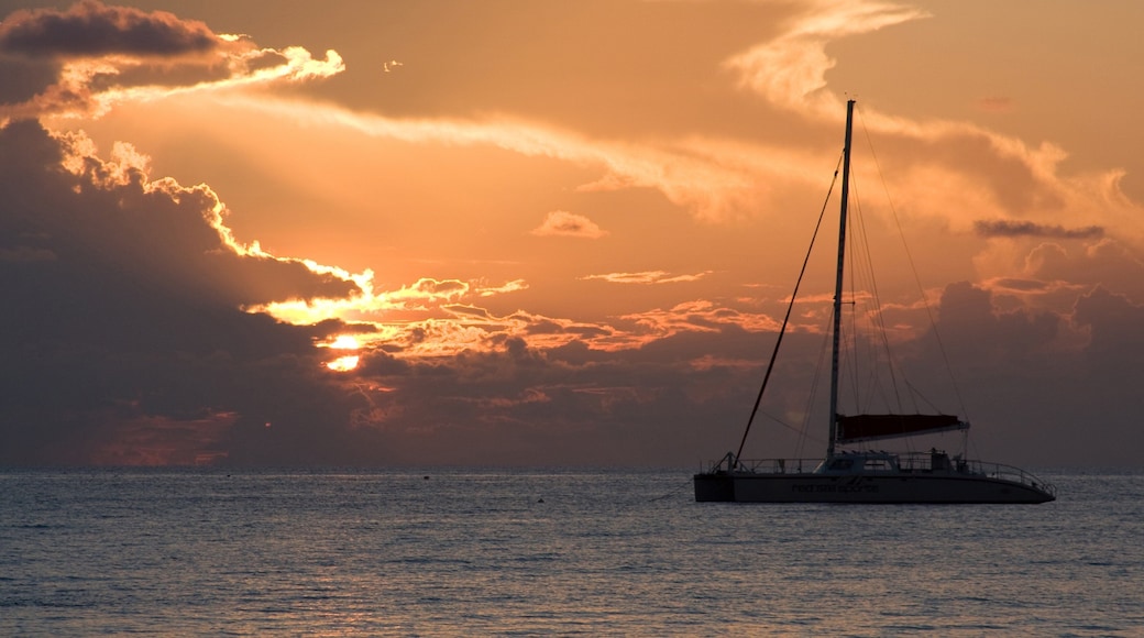 Cayman Islands showing boating, sailing and a sunset