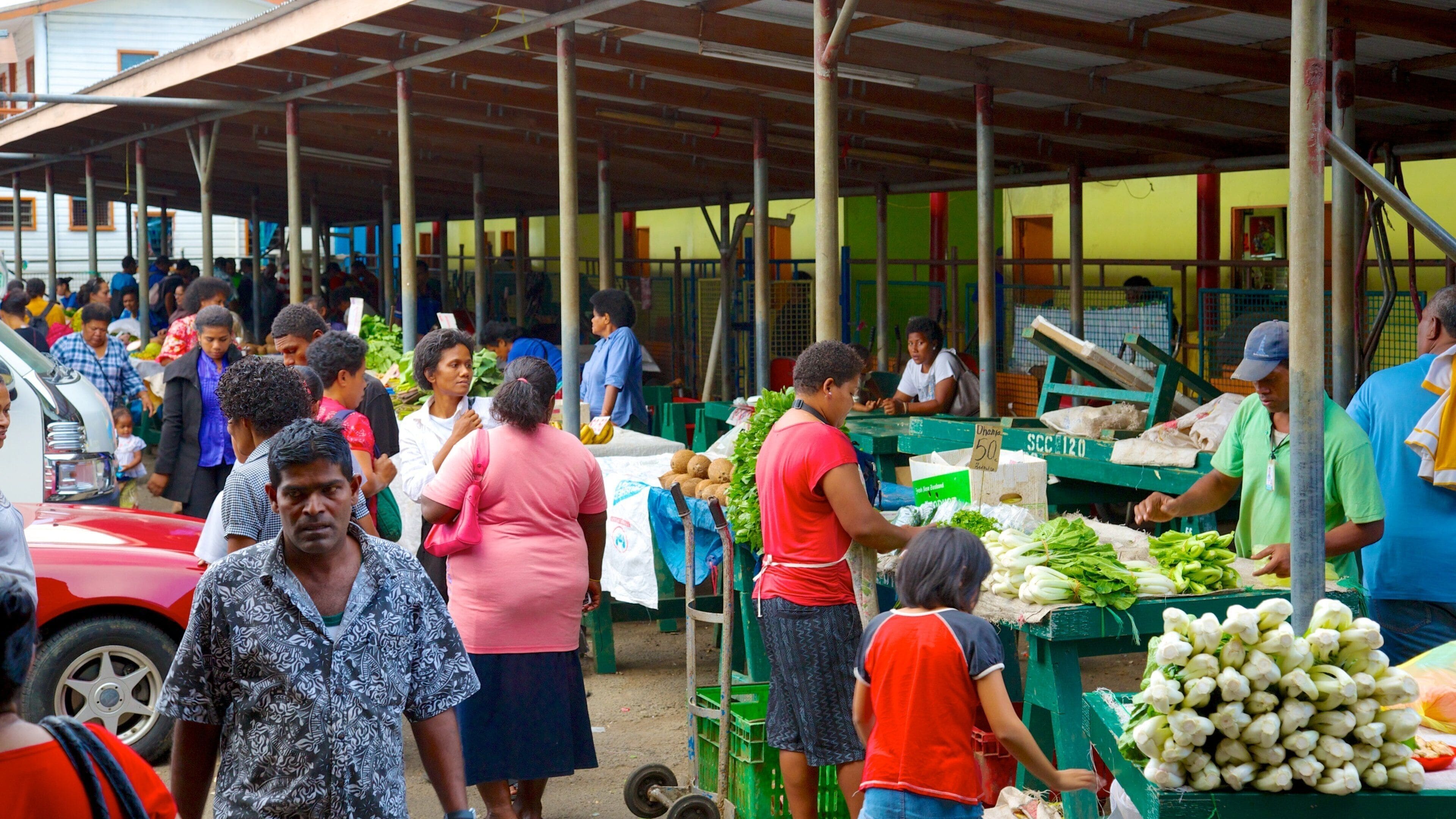 Suva which includes markets and street scenes as well as a large group of people