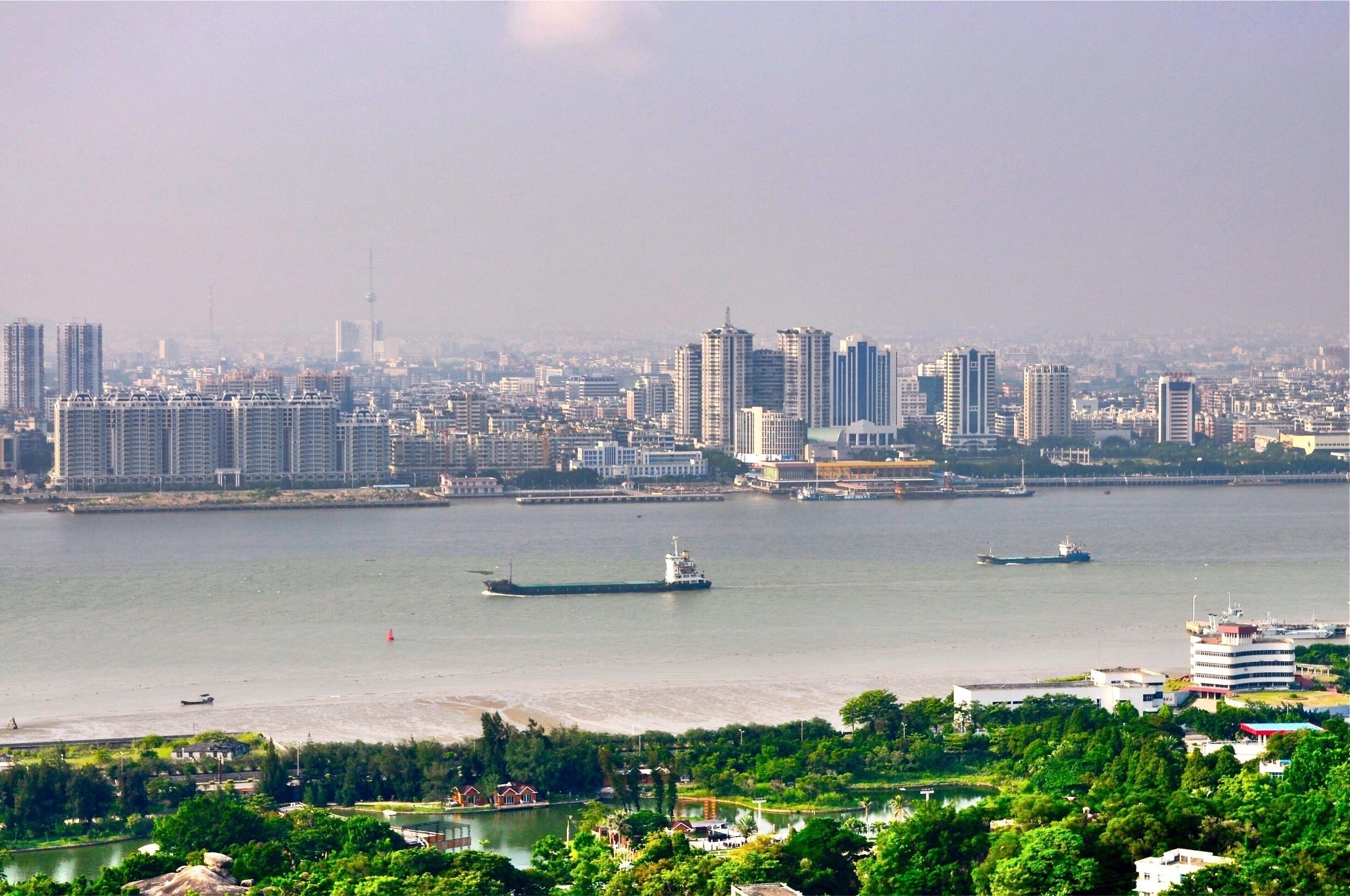Today, Shantou (汕頭) remains eastern Guangdong's economic centre and seaport, and is home to Shantou University, a member of the Project 211 group. (Wikipedia)
Picture: City centre of Shantou and Shantou Harbor 
#China #Guangdong #Shantou #Asia #QueshiScenicArea #ShantouHarbor #Chine #river #port #citycentre #AboveItAll