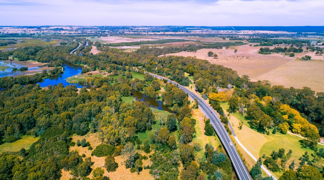 Rural highway passing through beautiful countryside in Victoria, Australia