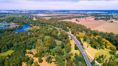 Rural highway passing through beautiful countryside in Victoria, Australia