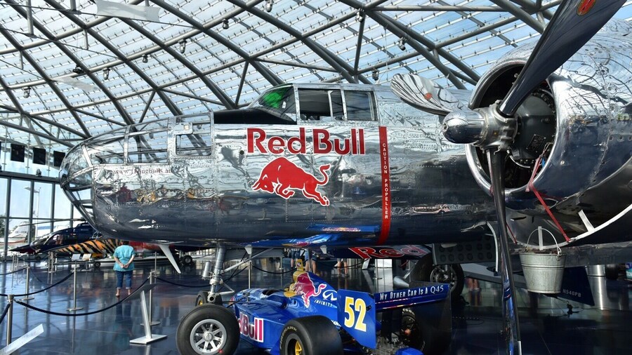 http://www.hangar-7.com/de/
Hangar-7 is a building in Salzburg, Austria, hosting a collection of historical airplanes, helicopters and Formula One racing cars, and serving as home for the Flying Bulls, an Austrian aviation team. Hangar-7 is owned by Red Bull founder Dietrich Mateschitz. It houses the Michelin starred restaurant Ikarus,two bars and a lounge. The building is airfoil shaped, constructed of 1,200 tons of steel and 75,000 sqft of glass surface