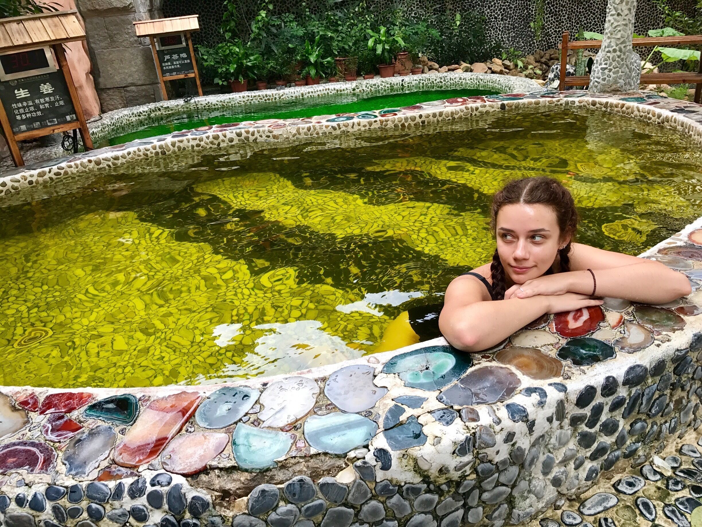 Guanlan hot springs are a perfect place to relax. There are several indoor pools, but I recommend you to go to the outdoor hot pools. Temperature is 36-37 degrees centigrade and they are filled with a variety of extracts like rose, jasmine etc.. Besides there is a list of massages provided. 
Entrance ticket costs 98 RMB, which doesn't include massages. 

Address: Huanguan South Road, Junzibu Village, Guanlan Town, Bao’an District, Guangdong
Business hours: 8:30- 19:00
We took a metro to Qinghu station , exit D and then a bus M339 to XingFa LuKou stop