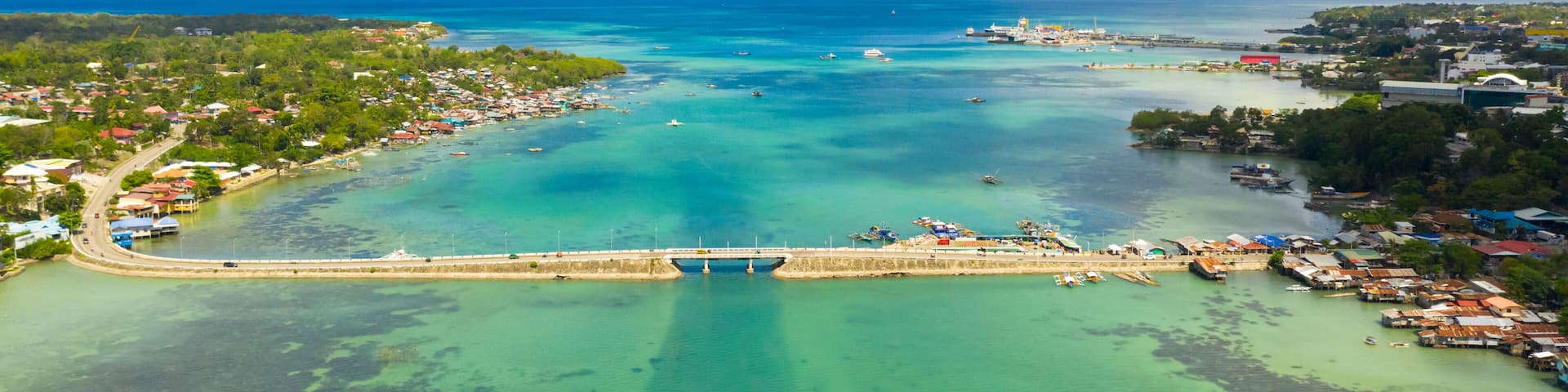 Aerial view of the Dauis bridge between Bohol and Panglao Islands. Bridge over the sea Strait with traffic and cars. Bohol,Philippines.