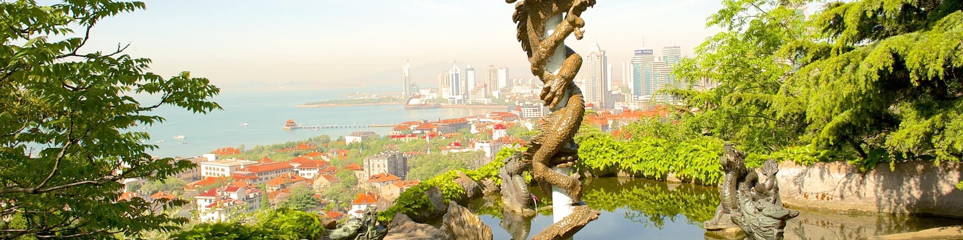 Qingdao which includes a coastal town and a pond