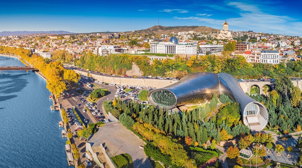 Aerial view of Tbilisi showing the Kura River, modern architecture
