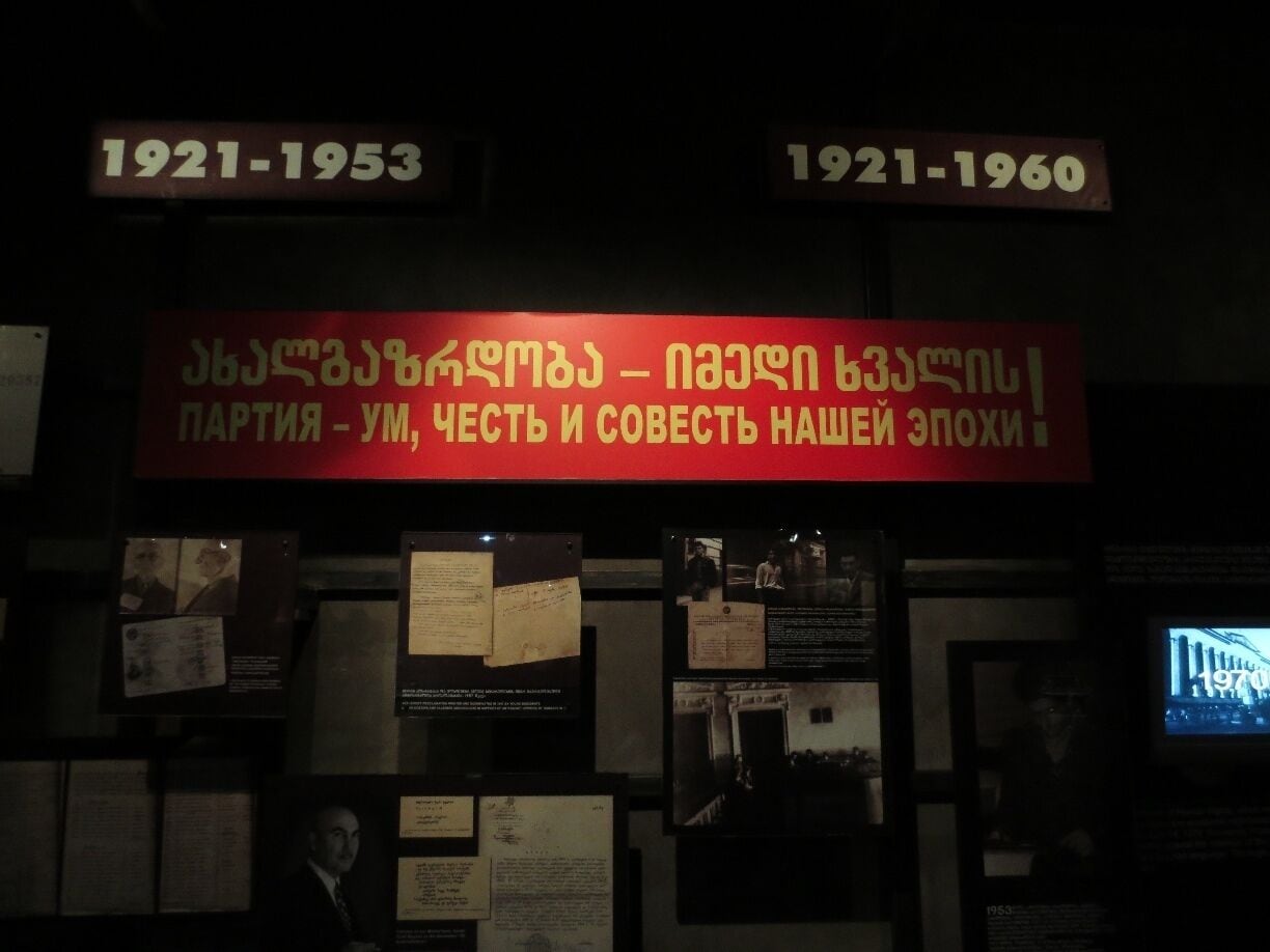 I'll butcher the translation, but the sign says something like, "the way forward is for the youth to have proper Soviet ideals" - this is an old Soviet era sign in the Georgian National Museum.  