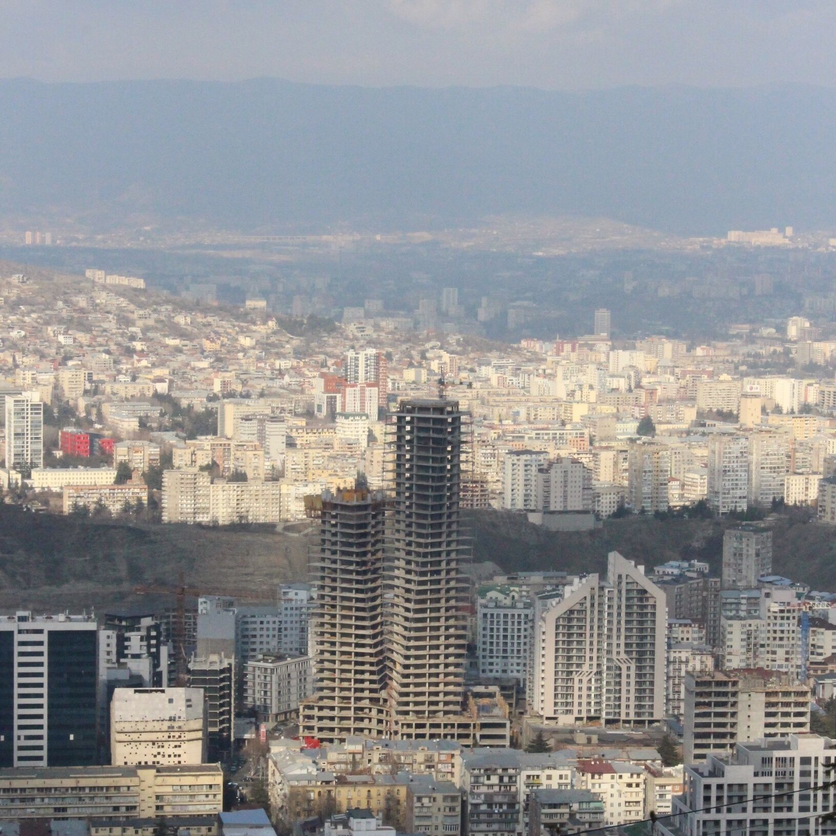 Looking out at an apartment complex under construction in the city of Tbilisi.

View from hillside located near Turtle Lake in the city. 
