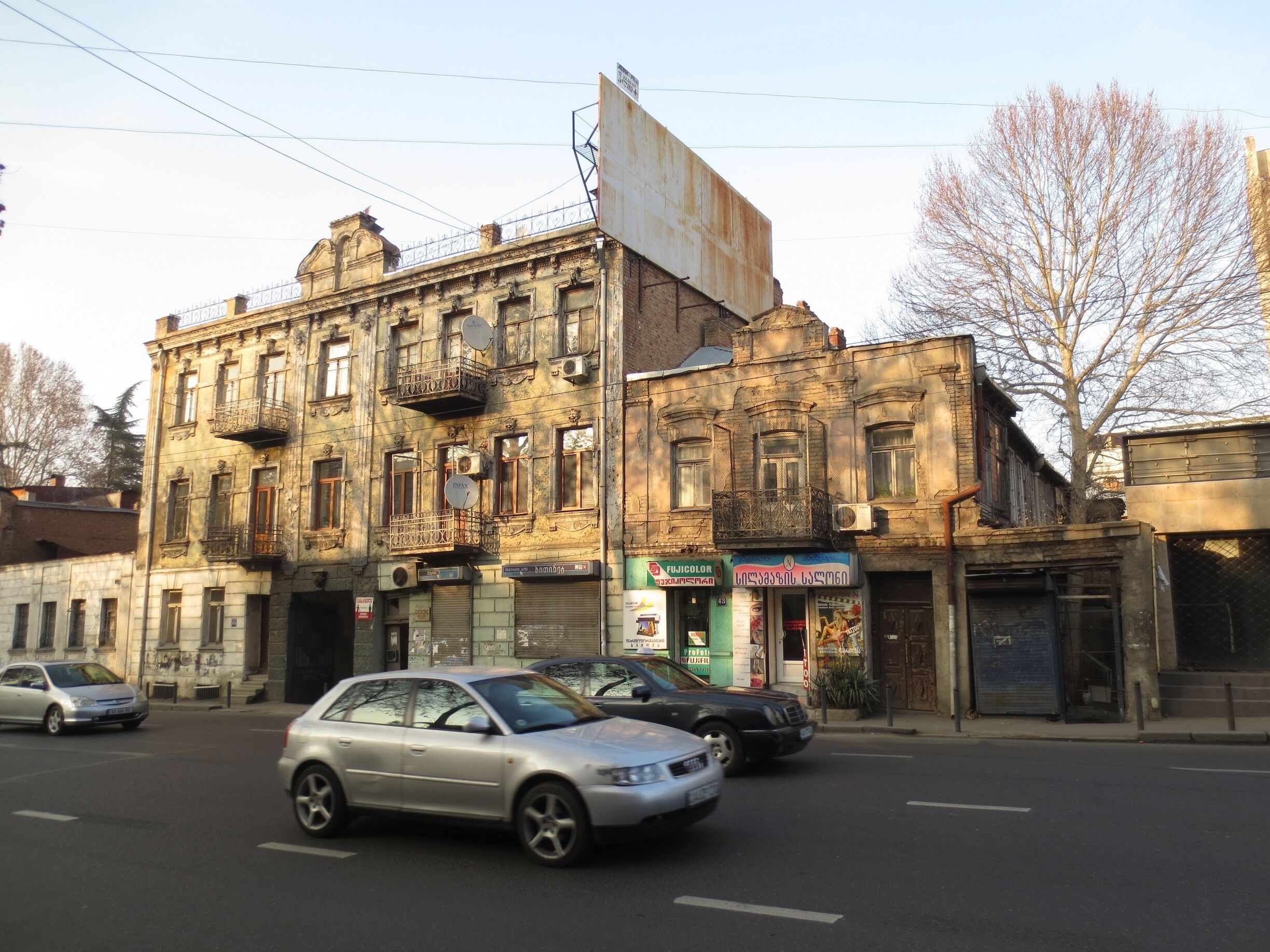 #architecture http://tinyurl.com/lnjfapv This building is one of my favorites in the city of Tbilisi, Georgia.

While I don't know much about architecture, I believe that this building is one of the few and dwindling examples of Art Nouveau architecture that remain in Tbilisi.

The top of this building features a date of 1912, and there's a number of frescoes and interesting masonry work on the outside. The building literally looks like it is rusting away.

Link is to an article about Art Nouveau architecture in Tbilisi.
