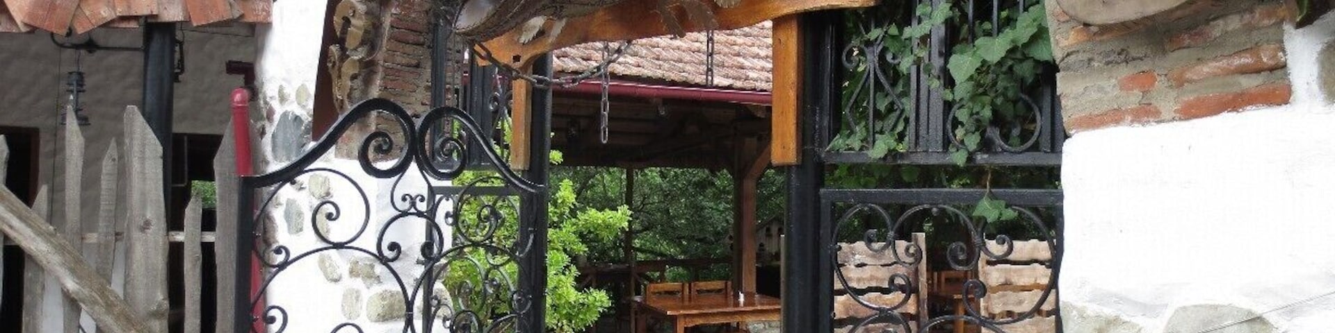 Elaborate metal sculpture at the entrance to a restaurant called "Monadire" in Tskneti, Georgia.