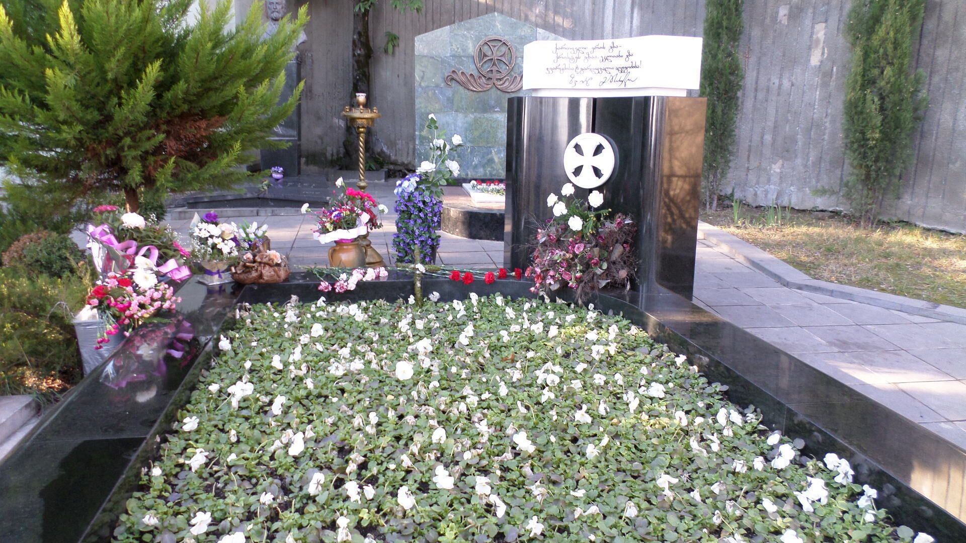 The grave of Georgia's first president, Zviad Gamasakhurdia.

His death, officially attributed to suicide, is still a frequent topic of conversation among men in the extremely macho political culture of Georgia.

Gamasakhurdia was exiled to the restive Russian region of Chechnya and his grave was briefly lost in the Chechen capital of Grozny during the civil war of the 1990s.

His grave was eventually rediscovered and he was reburied in the Mtatsminda Pantheon.  