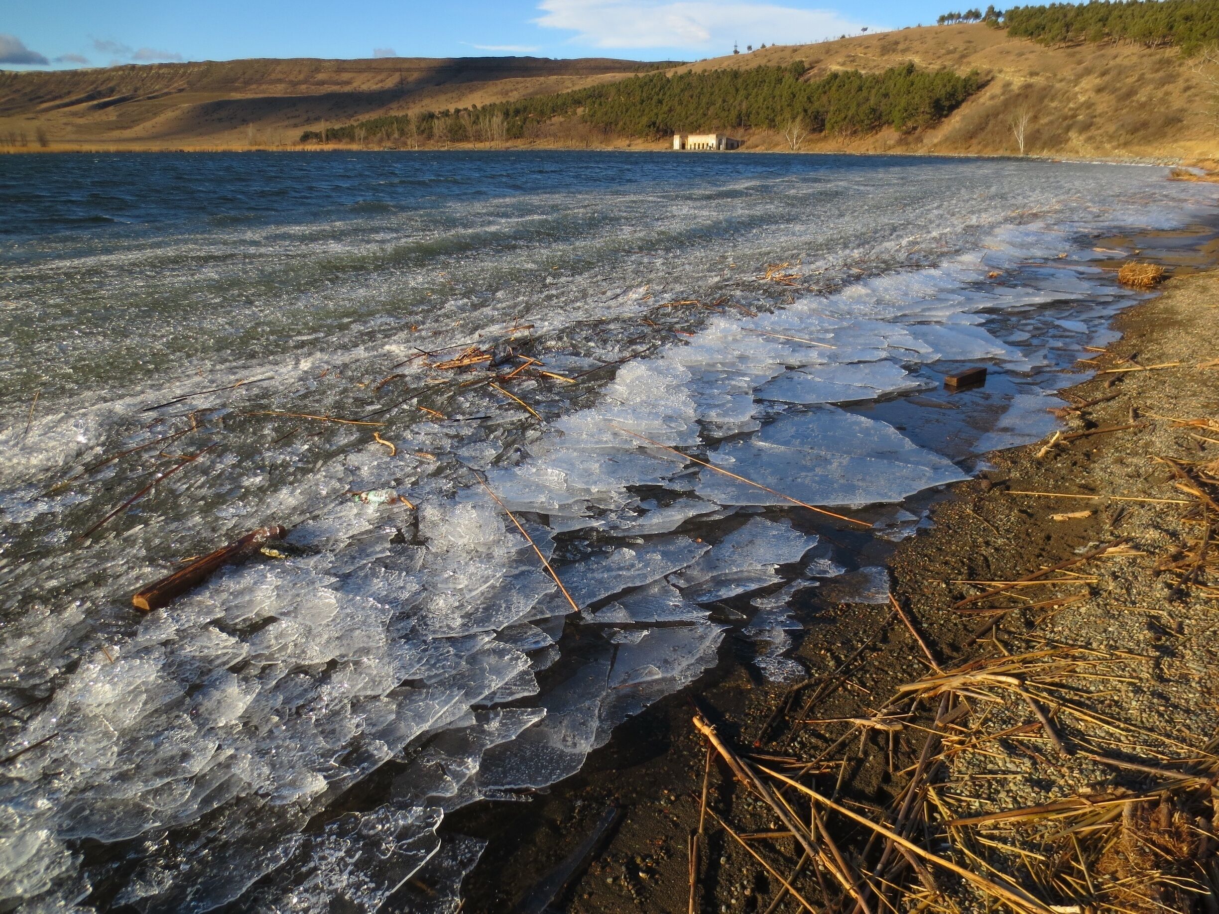 Frozen ice on the shore of Lisi Lake in the city of Tbilisi. 

Lisi Lake is a freshwater lake on a plateau that rises over the city. The entire surface of the lake froze during a recent cold snap. 

A brief climb in temperatures thawed most of the lake - the ice that remained broke into pieces and was carried by strong winds to one part of the shore.