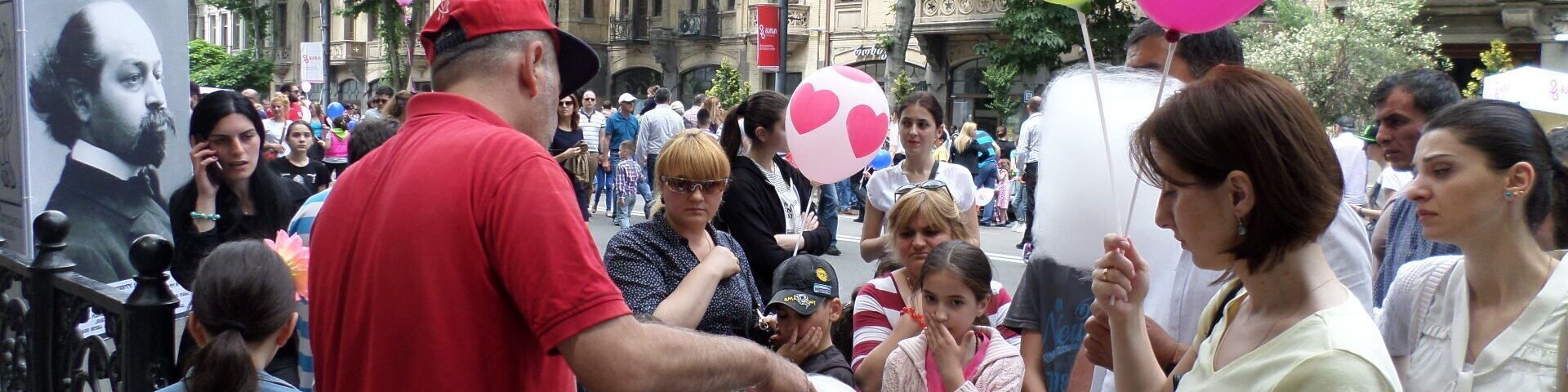 Man making cotton candy - view from the city of Tbilisi on Georgian Independence Day.