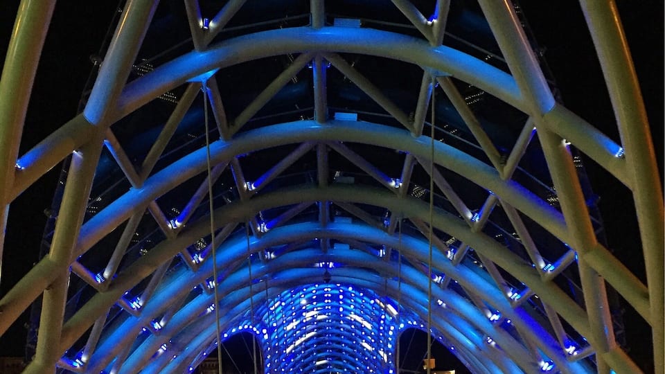 Pretty pedestrian bridge that is lit up at night :)