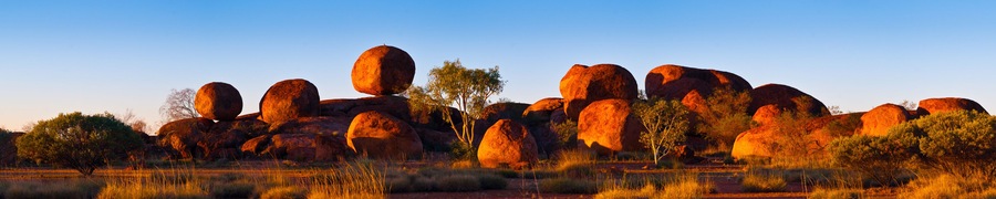 Devil's Marbles, Australia. The Devils Marbles are an extensive collection of red granite boulders in the Tennant Creek area of Australia's Northern Territory