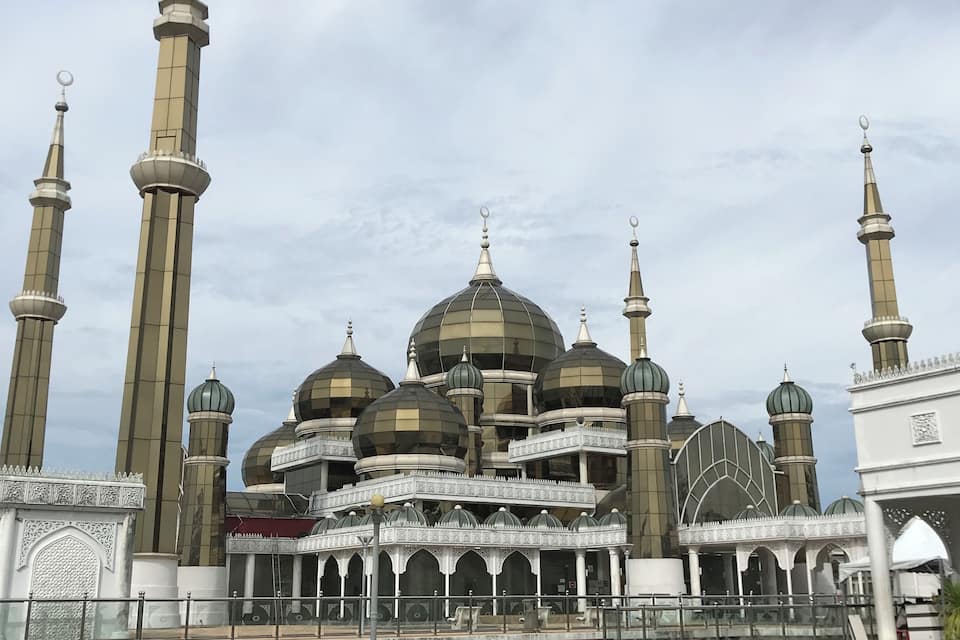 A mosque with multiple domes and tall minarets.
