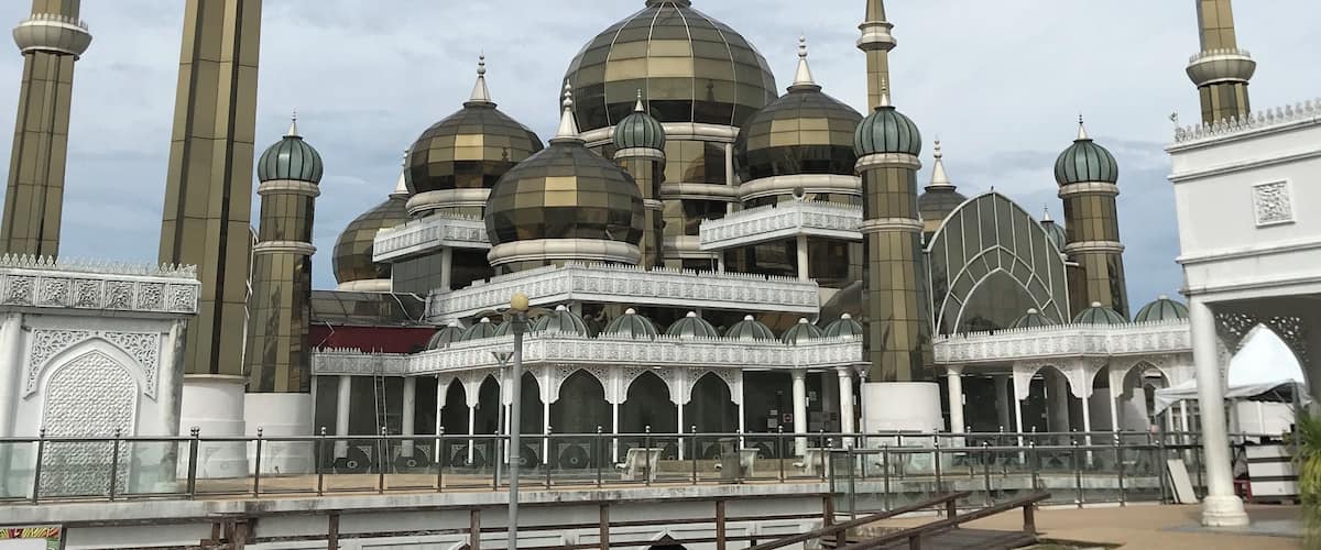 A mosque with multiple domes and tall minarets.