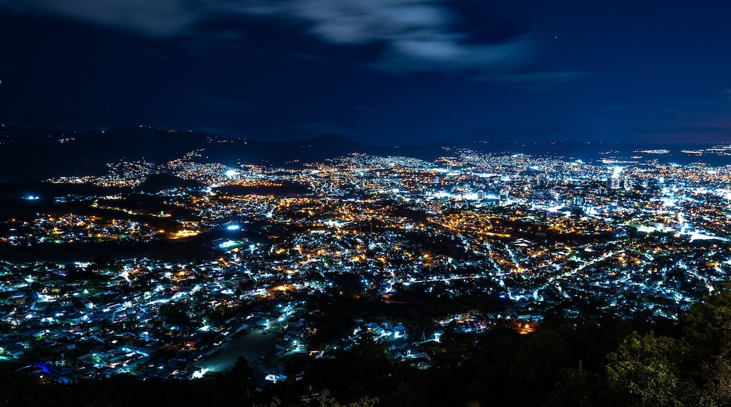Wide Panoramic Colorful Tegucigalpa Night Cityscape Long Exposure Shot With Blurred Clouds