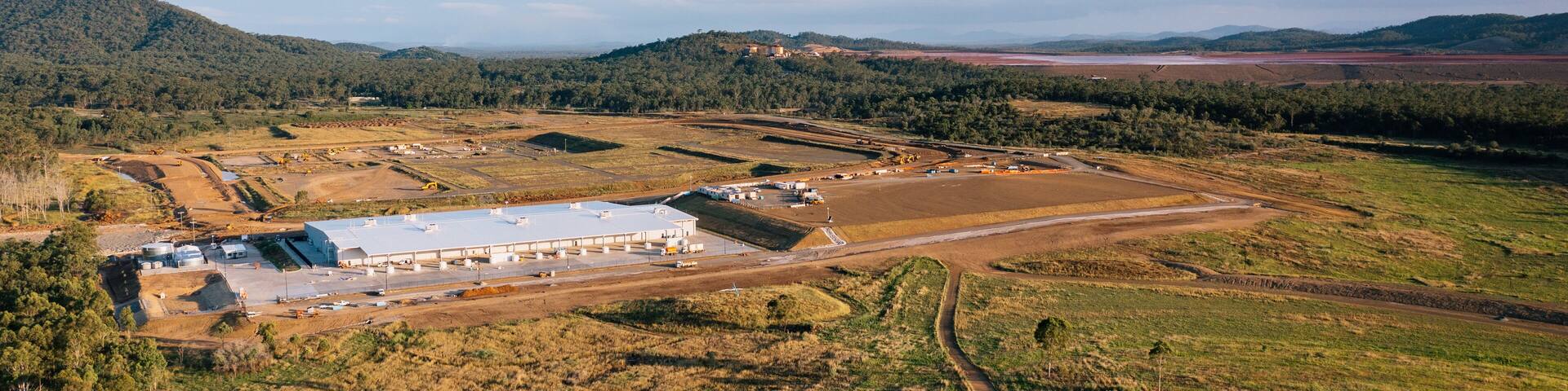 View of Aldoga hydrogen park near Gladstone, Queensland, with auxite red mud dam in background