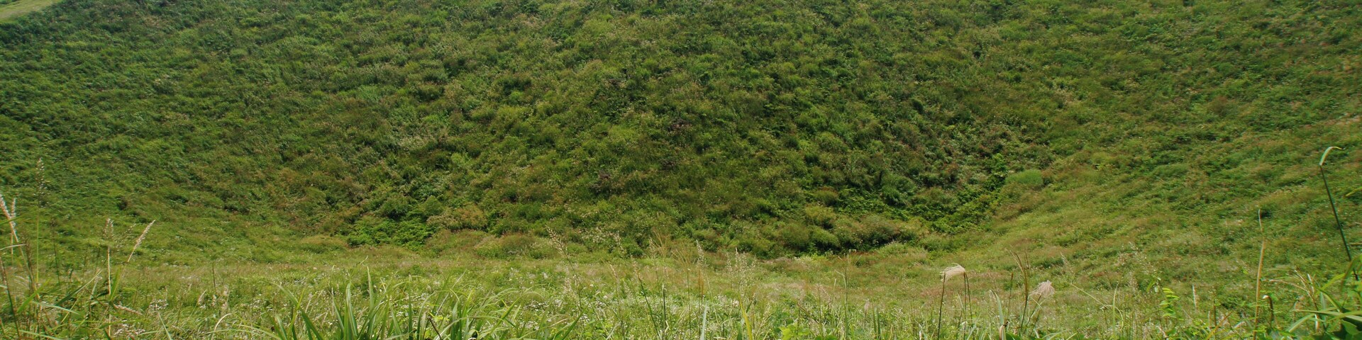 The crater of Mount Kannabe in Kannabe highlands, Toyooka, Hyogo prefecture, Japan. The Kannabe monogenetic volcano group including Mount Kannabe is a part of "San'in Kaigan Global Geopark" which joins in Global Geoparks Network.