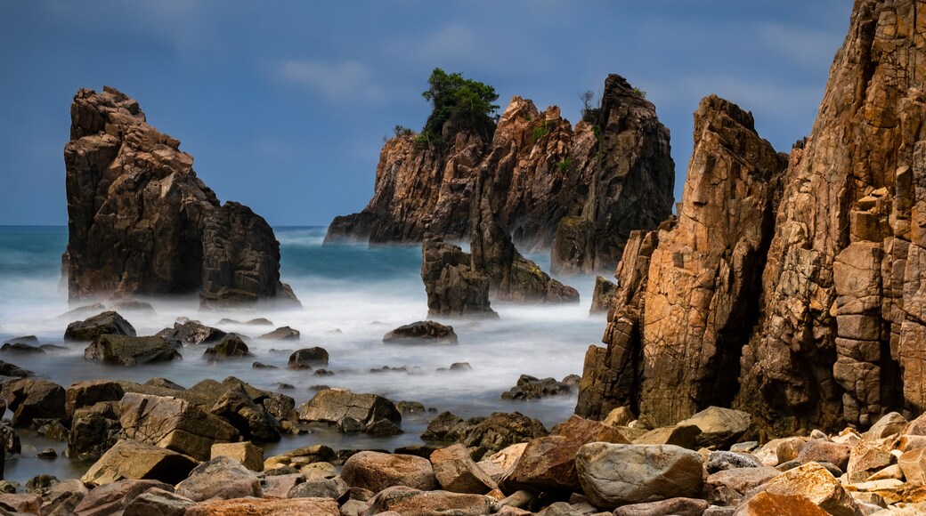Dramatic rock formations at Sharks Teeth Beach (Gigi Hiu), Lampung, Sumatra Island, Indonesia