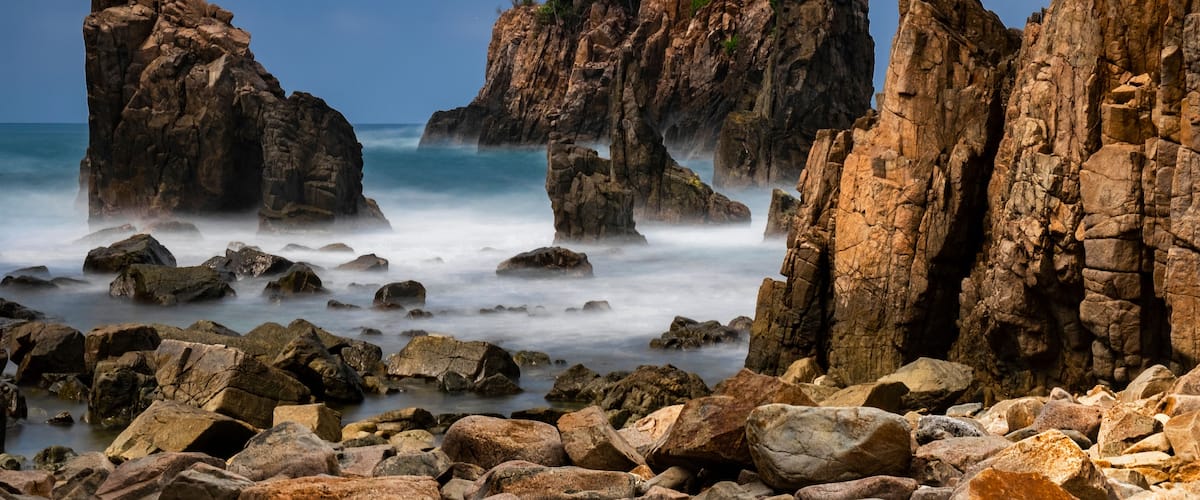 Dramatic rock formations at Sharks Teeth Beach (Gigi Hiu), Lampung, Sumatra Island, Indonesia