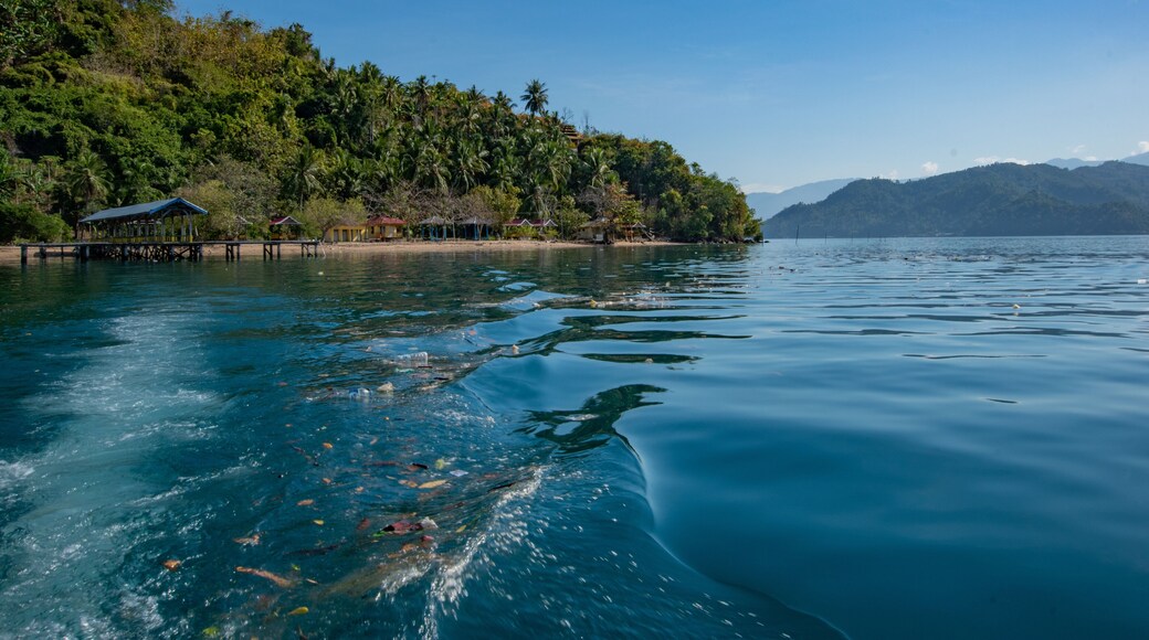 Traditional beachside village in lutungan island tolitoli central sulawesi indonesia with clear blue sky