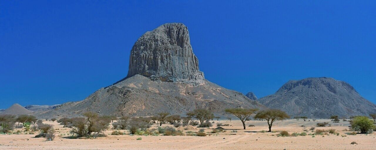April 2011 
Iharen peak or Pic Lapperine, Ahaggar mountains, Sahara, Algeria 

Iharen is a beautiful volcanic scoria cone peak near Tamanrasset en route to Assekrem in Ahaggar mountains in Central Sahara. Its altitude is 1.732 metres and its second name is after French general who lived and died in Sahara in 1920. Actually Tamanrasset was originally named Fort Lapperine. Iharen is popular spot for climbers however just the view from below is amazing. 