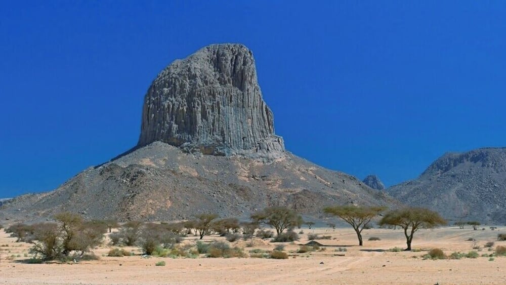 April 2011
Iharen peak or Pic Lapperine, Ahaggar mountains, Sahara, Algeria
Iharen is a beautiful volcanic scoria cone peak near Tamanrasset en route to Assekrem in Ahaggar mountains in Central Sahara. Its altitude is 1.732 metres and its second name is after French general who lived and died in Sahara in 1920. Actually Tamanrasset was originally named Fort Lapperine. Iharen is popular spot for climbers however just the view from below is amazing.