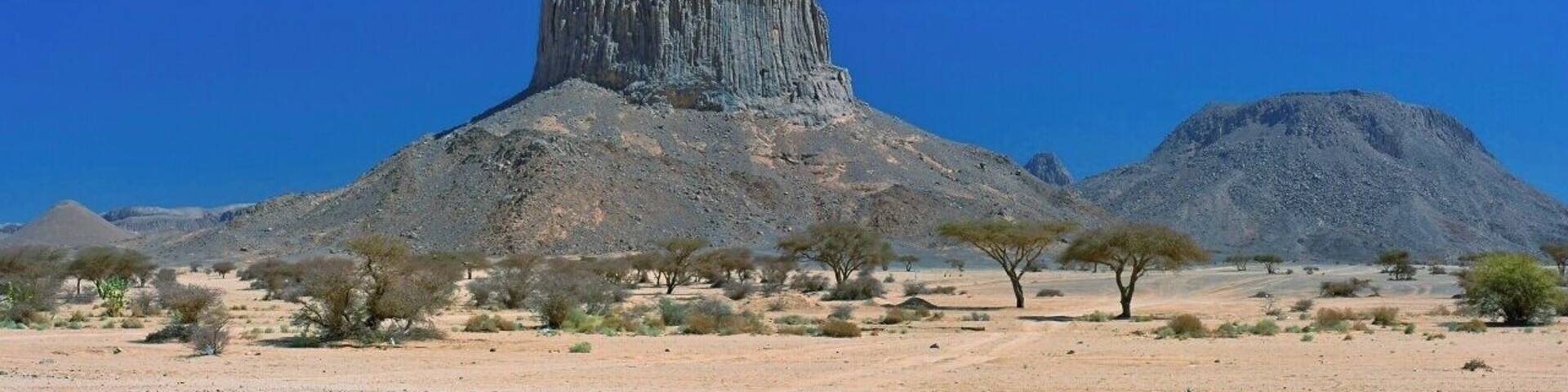 April 2011
Iharen peak or Pic Lapperine, Ahaggar mountains, Sahara, Algeria
Iharen is a beautiful volcanic scoria cone peak near Tamanrasset en route to Assekrem in Ahaggar mountains in Central Sahara. Its altitude is 1.732 metres and its second name is after French general who lived and died in Sahara in 1920. Actually Tamanrasset was originally named Fort Lapperine. Iharen is popular spot for climbers however just the view from below is amazing.