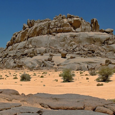 April 2011
Tin Salatin, Ahaggar mountains, Sahara
Tin Salatin rocks along the way from Assekrem and Ilaman towards Tamanrasset in Central Sahara on the outskirts of Ahaggar mountains which are called The Heart of Sahara. It is probably basaltic stone of volcanic origin.