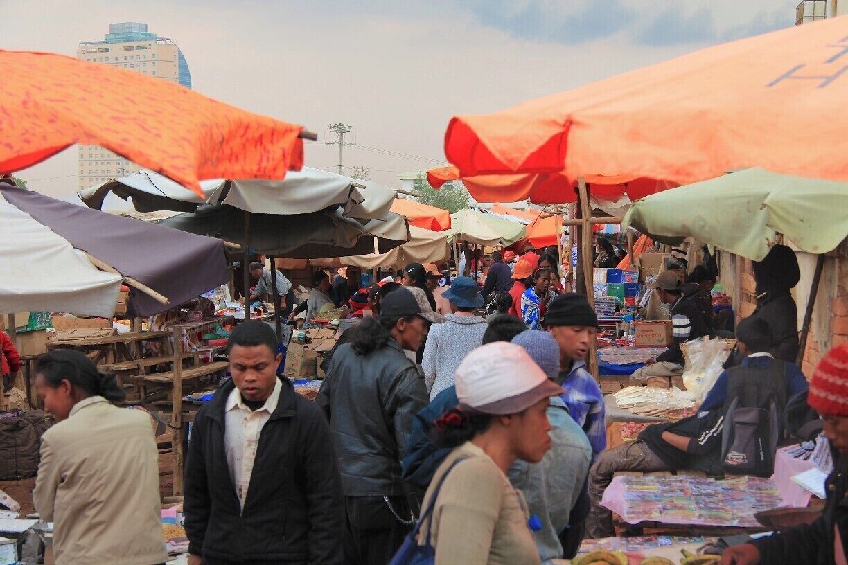 One of the busy markets of Madagascar's capital, Antananarivo (or Tana for short). The large building in the background is a Hilton,  a place that seems to juxtapose its surroundings.

#market